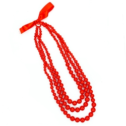 In the old days these red beads would have been made of real coral. Today new coral can no longer be imported so the Poles use a much less expensive substitute (polystyrene). These are made in Krakow for the Krakowianka dance costume