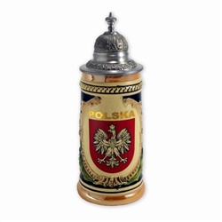 This beautiful stein is hand made and painted.  It features scenes from the Polish Tatra mountains and in the center, the Polish Eagle which is Poland's national emblem.  Please note that although the background color appears to be blue, it is actually da