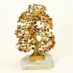 The leaves of this bonsai style tree are made with real polished amber stones attached to branches and trunk of twisted brass wire.  The tree sits atop a piece of the finest Polish marble called "Marianna".  Hand made so no two are exactly alike.