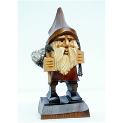 Hand carved in the mountain region of southern Poland this a Polish Troll with his mountain pick and he's carrying a real Polish mineral stone.  Hand made so wood shades vary. Size is approx  2" x 1.5" x 4.5" tall