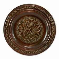 Hand Made in Southern Poland Polish wooden plates are made from Linden wood in the mountain region of southern Poland called Podhale. The plates are cut and shaped on a lathe by hand. The floral designs are burned into the wood then painted after staining