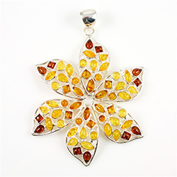 Hand made with Sterling Silver and genuine Baltic Amber in shades of dark honey, light honey, and light yellow.