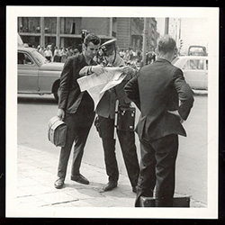 Seeking Directions From the Milicja - Warsaw, 1968.  Historical Black and White Photo Postcard.