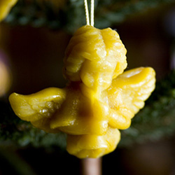 This pure beeswax hanging cherub angel is hand made by the residents of Dom Teczowy, a home for the mentally impaired located in Sopot, Poland.  Your purchase helps to support the Dom Teczowy Foundation that provides the care for the residents.