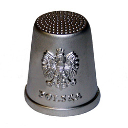 This silver-colored metal thimble features the classic Polish eagle on the front.  A beautiful collector's item.