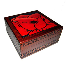 This beautiful box is made of seasoned Linden wood, from the Tatra Mountain region of Poland.  This unique box has a gorgeous red poppy on the lid and red-velvet lining inside.