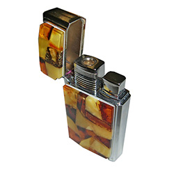 Unique and beautifully hand-crafted cigarette lighter with the front panel decorated in beveled highly-polished multi-colored shades of amber, the back panel is brilliant chrome-plated brass.  A nice weight and feel in your hands.