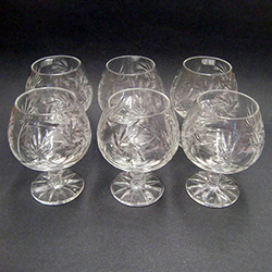 Genuine brilliant Polish 24% lead crystal hand cut with a pinwheel design in a stunning set of (6).