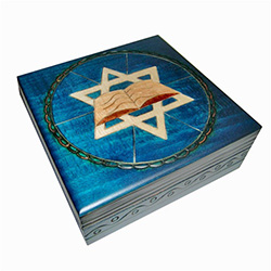 This beautiful box is made of seasoned Linden wood, from the Tatra Mountain region of Poland.  The top is adorned with the six-sided Star-of-David and the Torah.  The outside area and sides of the box are a deep blue color.  Note: the last photo is closer