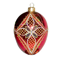 The egg is the symbol of new life and the  cross represents Christ's triumphant victory.  Hand blown and decorated with Swarovski crystals.  Beautiful red and gold colors.