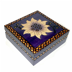 Violet colored box with a hand painted and burned flower design.