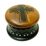 Round hand-painted box with a cross on the lid.