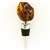 Modern design chrome-plated wine stopper with a large chunk of highly-polished honey amber at the top.  Soft-rubber segmented gasket ensures a tight seal in the neck of the bottle.