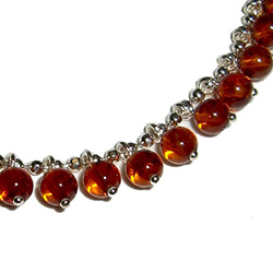 7.5" Honey Amber Charm Bracelet; Circular Honey Amber beads on Sterling Silver w/claw clasp.