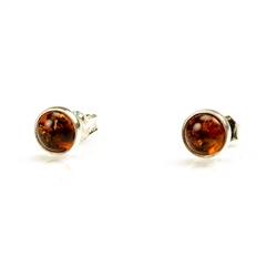 Honey Amber Earrings with Sterling Silver setting and post backs.  Amber is soft, only slightly harder than talc, and should be treated with care.Amber is soft, only slightly harder than talc, and should be treated with care.