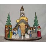 The Holy Family and in particular the Nativity is a popular theme in Polish folk art.   This is the work of Jerzy Zrbozek
The Chapel in the back and all the figures are placed on the base which means the figures can be moved or arranged on another