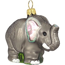 This adorable elephant is ready to stampede his way into your heart and onto your tree this Holiday Season! With vivid glazes and sparkling glitter accents, this 2" tall elephant ornament is artfully crafted of glass from Poland.