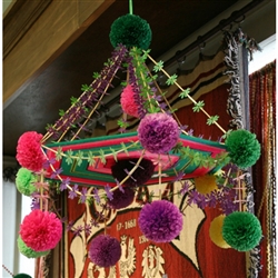 This pajak comes from the town of Nieborow, not far from Lowicz.  It is made with tissue paper, straw and feature a center of colorful yarns.   Some have strings of beads and no two are ever alike.  Completely made by hand by our local artist, each takes