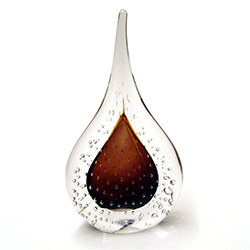Two-sided art glass paperweight, with a gorgeous amber interior core, surrounded by flurry of bubbles, in a classic teardrop shape.  Each piece is hand blown and hand finished in Poland.  Made with the highest quality craftsmanship and hand-signed by the