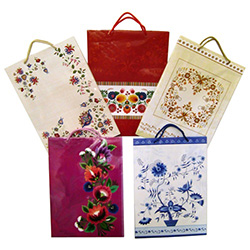 Delightful Polish folk themed paper gift bags are the perfect way to present those special gifts.  Glossy color paper with cloth handles, cardboard bottom insert for added strength and all made in Poland.  Set of 5 different patterns.