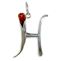 Approximately 1" tall - (2.5cm) size sterling silver and amber charm.  Classic Calla Lily shape.