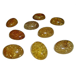 Approx .5" x .75" x .25: thick - 15mm x 20mm x 7mm thick.  These oval domed amber cabochons are quite sparkly.  Price is per piece.