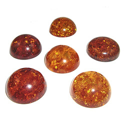 Approx .68" x .31" thick - 17mm x 10mm thick.  These are round domed amber cabochons.  Price is per piece.