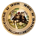 The translation of "Gosc W Dom Bog W Dom: is "A Guest In The House Is God In The House" . 
This beautiful plate is made of seasoned Linden wood, from the Tatra Mountain region of Poland.