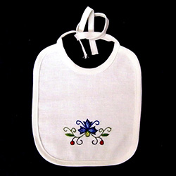 Hand embroidered Kashubian flowers on a child's cotton bib.