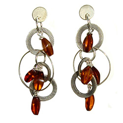 Amber beads and silver discs combine to make one very cute set of earrings!  Note that the silver discs are printed with a pattern that gives them a matte type finish.