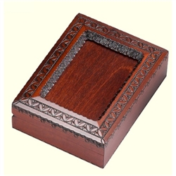 An absolutely beautiful box!  Walnut stained box with detailed picture frame on the beveled top. Frame has a opening on one side to slide in a photo, but this box is just as beautiful as is. Made for wallet size photos: 3.5" x 5".
Box also opens to a red