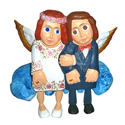 Our happy couple are sitting on a cloud in Heaven.	 This piece is designed to sit on a shelf.   Signed by the artist. Master carver Waldemar Styperek is best known for his beautiful carvings of angels.