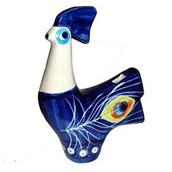 Collectors of Polish stoneware will enjoy this unique item.  This is a folk whistle with three holes: one to blow into and one for the air to exit and one to modulate the whistle tone.  You blow into the tail hole and move your finger over the breast hole