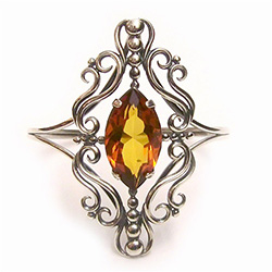 Victorian-style marquis-cut clear amber stone mounted in sterling silver, to make a gorgeous cuff bracelet.  The high-quality clear amber stone is without inclusions or internal flaws, and its beauty is set off with the detailed silver filigree work that