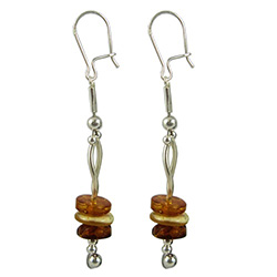 Precious-looking set of dangle earrings, consisting of a multi-colored stacked set of amber discs, with a French hook attachment and strung on two pieces of artistic silver.