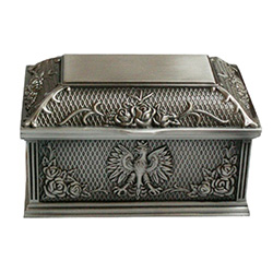 Ornately decorated tin plated metal jewelry/pill box.  Dark satin interior with a hinged top..  3" - 9cm wide.