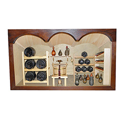 Poland has a long history of craftsmen working with wood in southern Poland. Their workshops produce beautiful hand made boxes, plates and carvings.  This shadow box is a look inside a traditional winery.