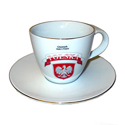 Attractive cup and saucer set with the Polish eagle below a red and white Polska banner.  The rims of the cup and saucer are trimmed in gold.  Hand washing recommended and not for use in the microwave.