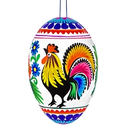 Decorating eggs with paper cuts is a tradition from the Lowicz region of central Poland. Hand made. Assorted designs and colors. No two are exactly alike.