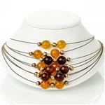 Eight beautiful strands of round amber beads in three shades on silver wire.  Each amber bead is separated by a silver sphere.