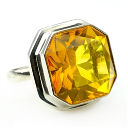 A perfectly cut square piece of faceted honey amber set in sterling silver.  Size is approx 1" square.
&#8203;