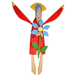 Hand carved painted folk angel by carver Maciej Manowiecki.  The artist is known for his unique, whimsical style.  His work can be characterized by the use of unconfined form, vibrant color, and lightness of style which brings each piece to life.