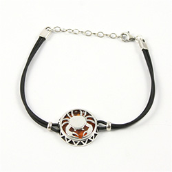 Sterling Silver and Baltic amber Cancer zodiac sign charm on a durable cord made of black rubber.