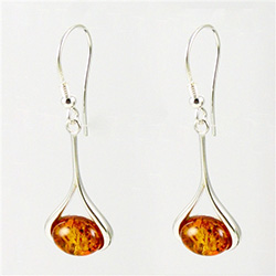 Honey amber wrapped in Sterling Silver teardrops.  Stylish and unique.