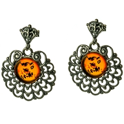 Honey amber circles centered inside an ornate Sterling Silver design.  Stylish and unique earrings.