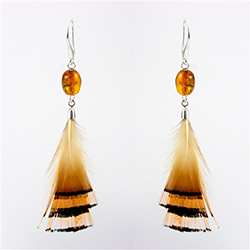 Honey amber drops with stylish feathers with sterling silver findings. Stylish and unique.