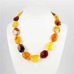 This beaded Amber necklace features shades of yellow, honey, green, and cherry Amber. The beads are hexagonal and slightly faceted.  We have several in stock so the arrangement of the beads will vary from the picture.