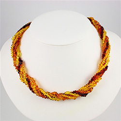 Composed of four strands of multi-colored amber beads.