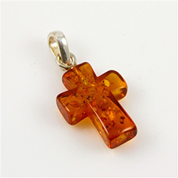 Free form piece of Baltic amber in the shape of a cross. Size , weight  and colors vary.