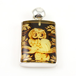 Beautifully carved owl in rectangular shaped amber pendant framed in sterling silver. Size approx. .8" x 1.25" - 2cm x 3cm (including finding.  Cameo is square shaped.